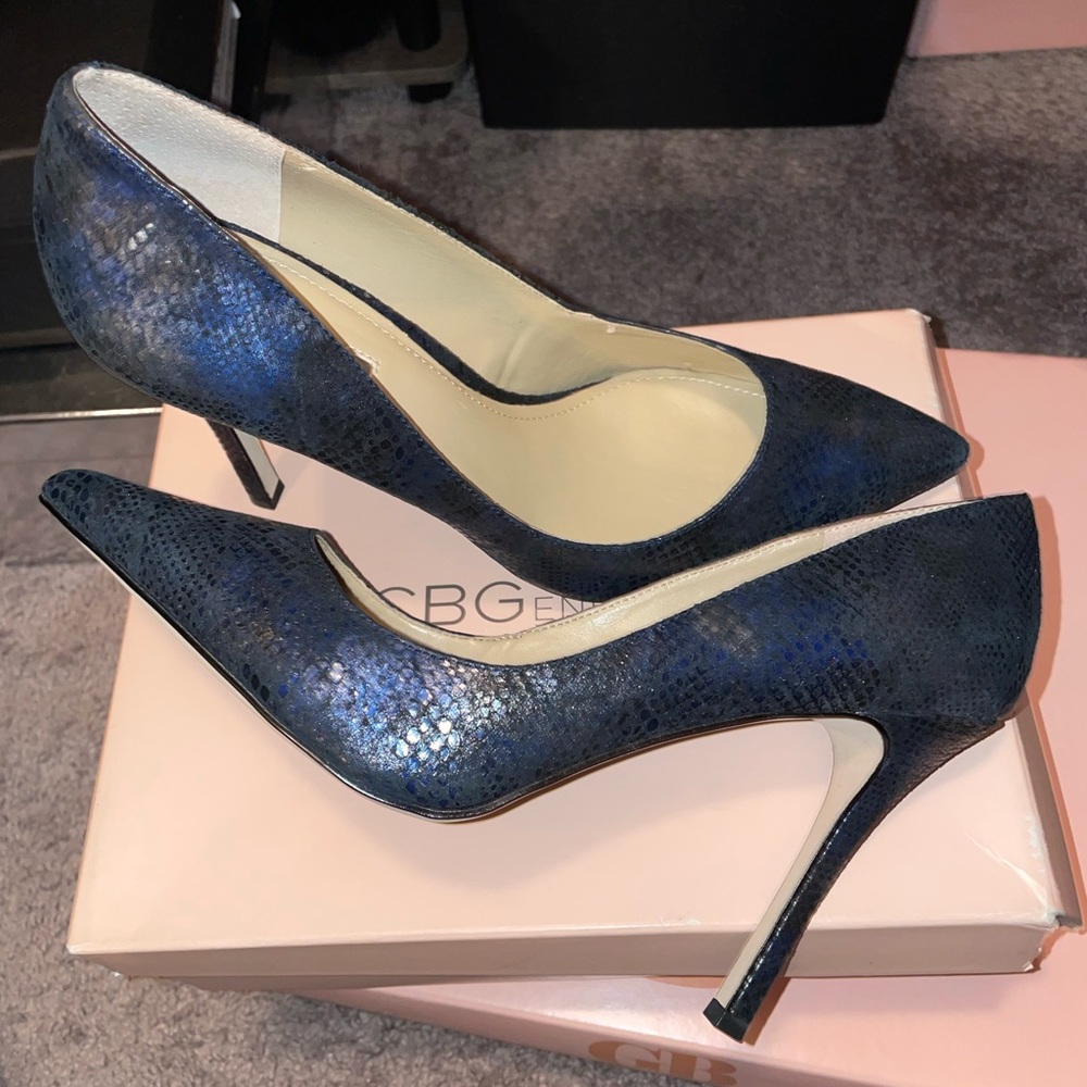 Dark colored pointed toe pumps